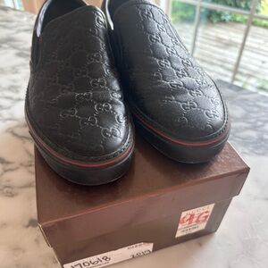 Gucci Men's Embossed Black Slip-On Loafers